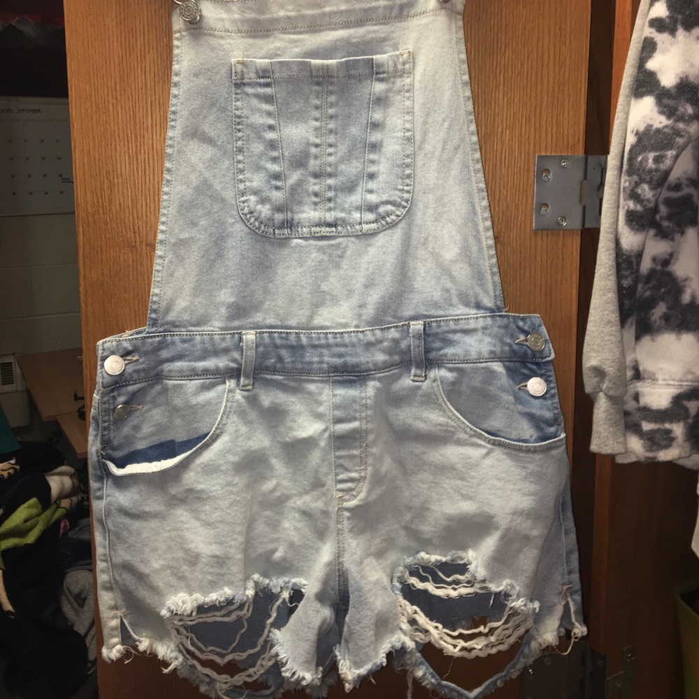 Distressed light blue overalls